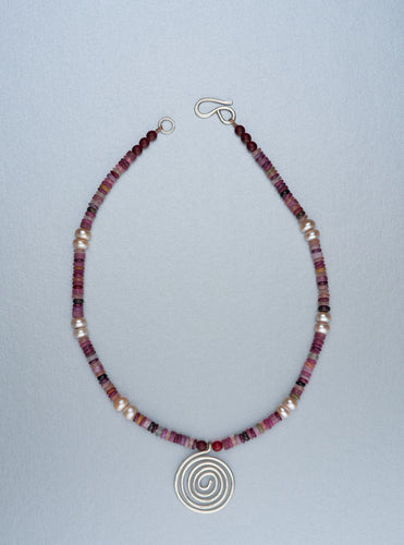 Beaded necklace with silver spiral pendant