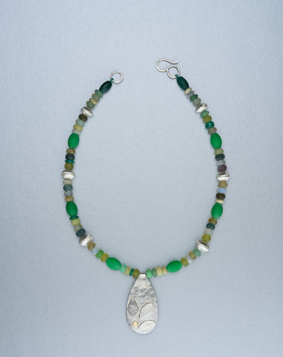 Beaded necklace with silver pendant