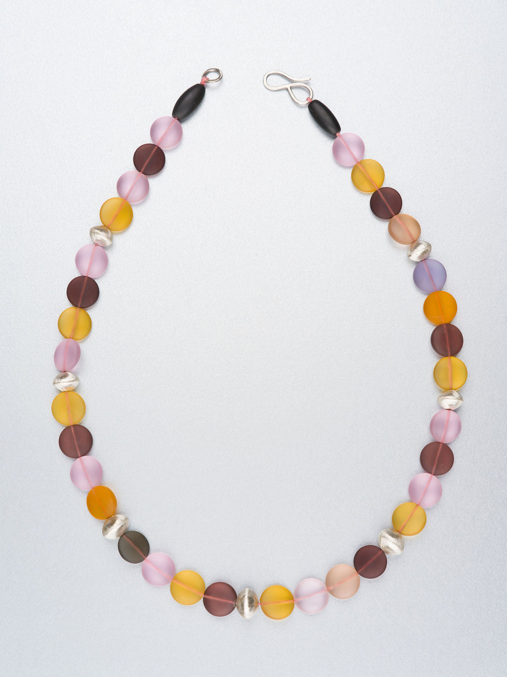 Beaded necklace with hand forged silver beads