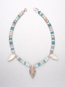 Beaded necklace with leaf pendants