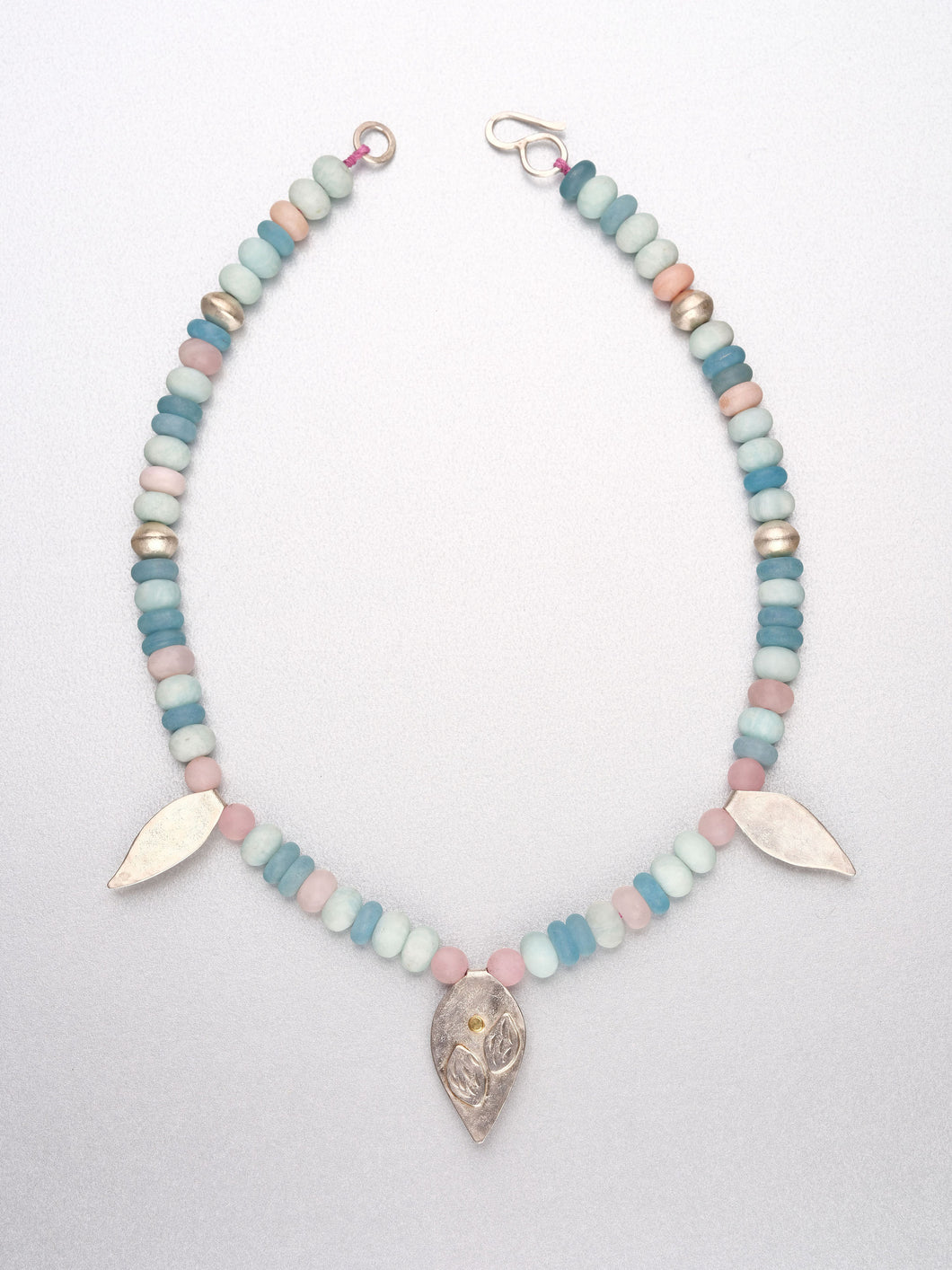 Beaded necklace with leaf pendants