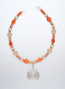 Beaded necklace with silver spiral pendant