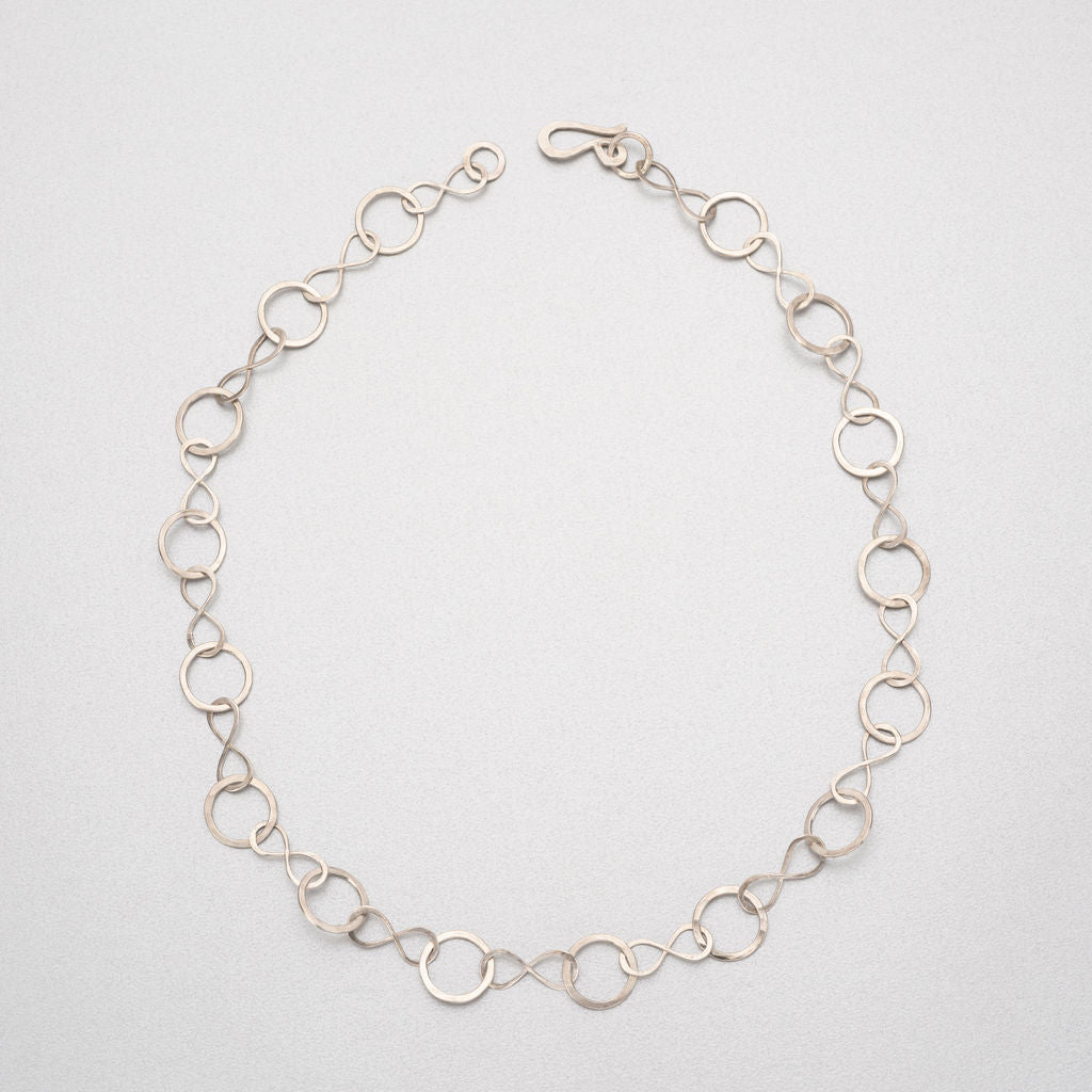Hand beaten silver chain with figure of eight and round links