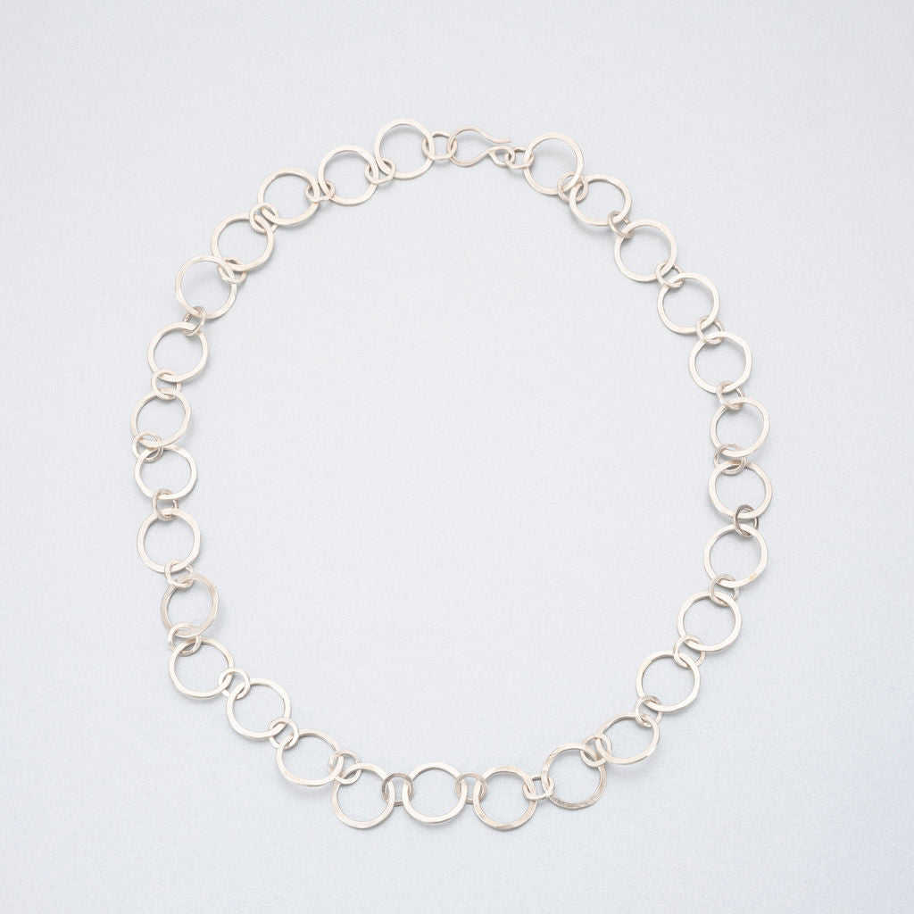 Hand beaten silver chain with round links