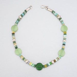 Beaded necklace with sea glass discs