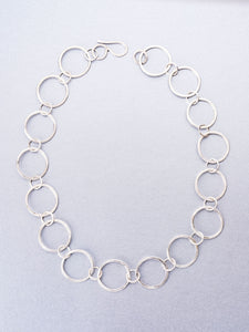 Hand beaten silver chain with round links