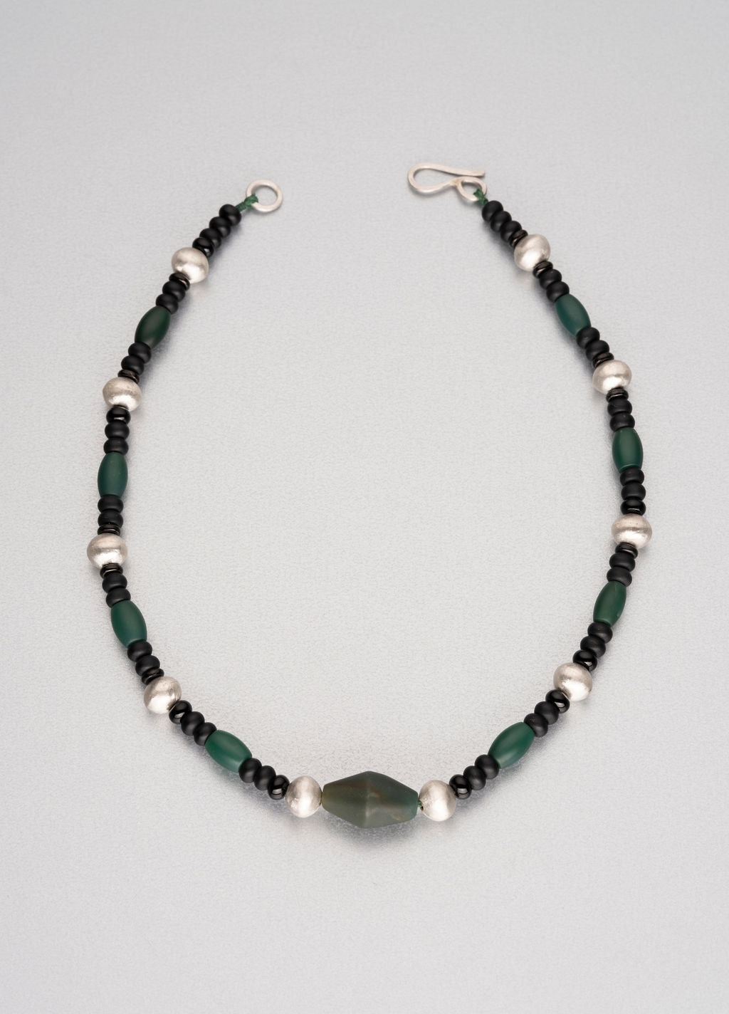 Assorted semi-precious stones and silver necklace.